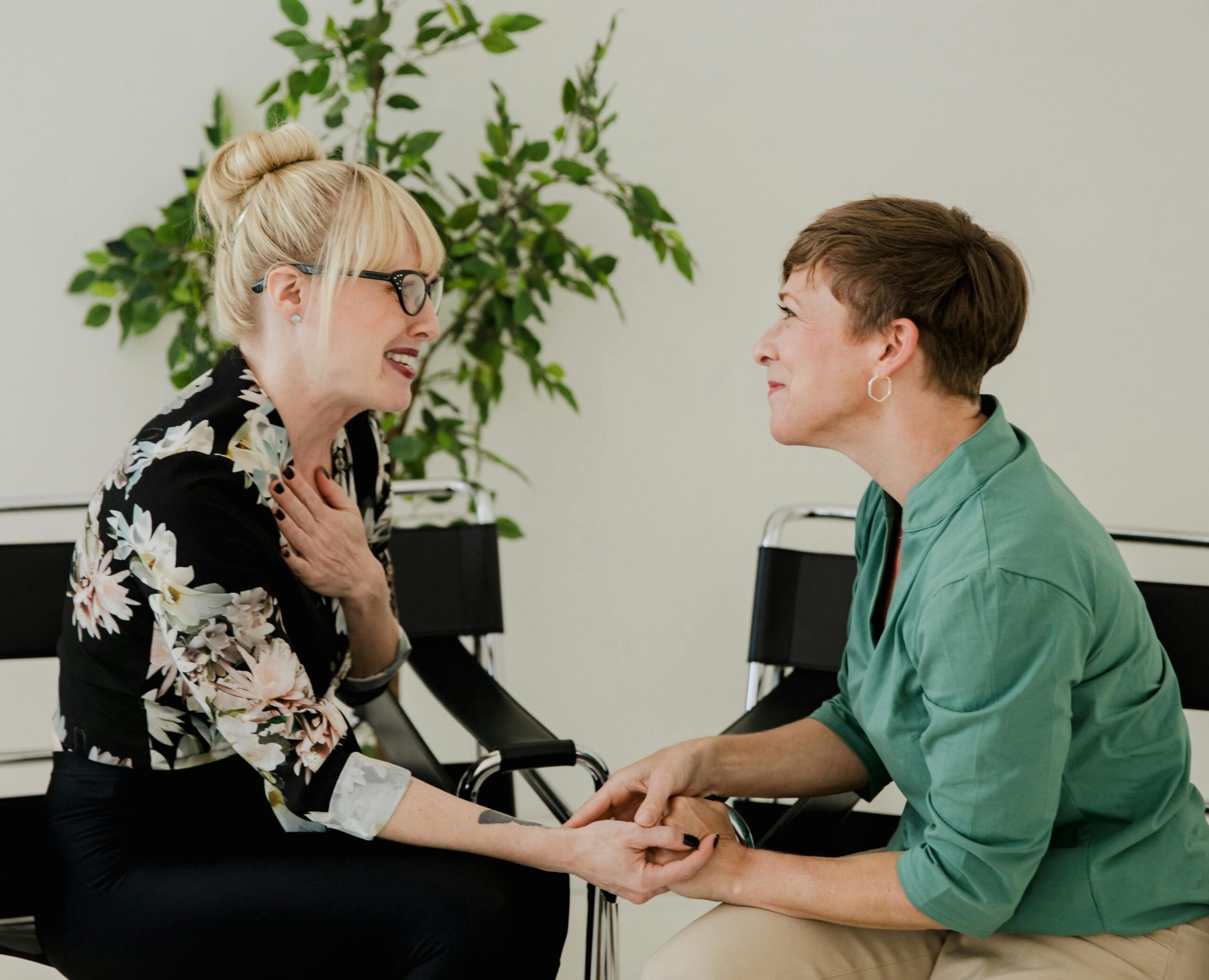 Therapist offering emotional support and encouragement to client during session Therapist offering emotional support and encouragement to client during session